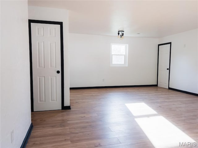 119 Freedom Dr, Belleville, IL 62226 - unfurnished room featuring light wood finished floors and baseboards