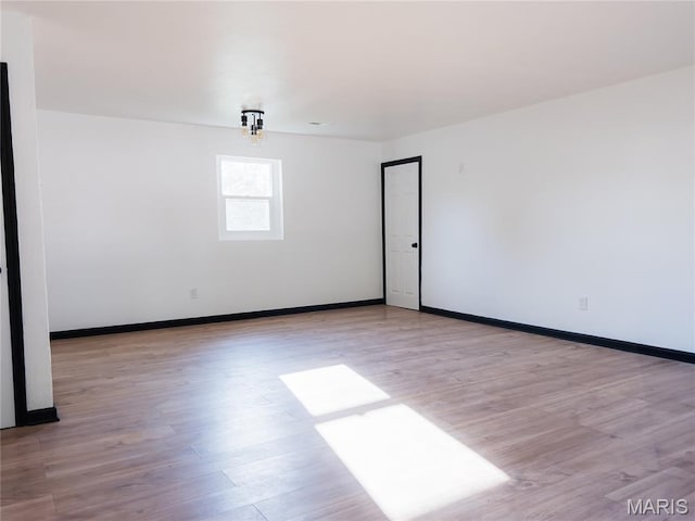 119 Freedom Dr, Belleville, IL 62226 - empty room with wood finished floors and baseboards