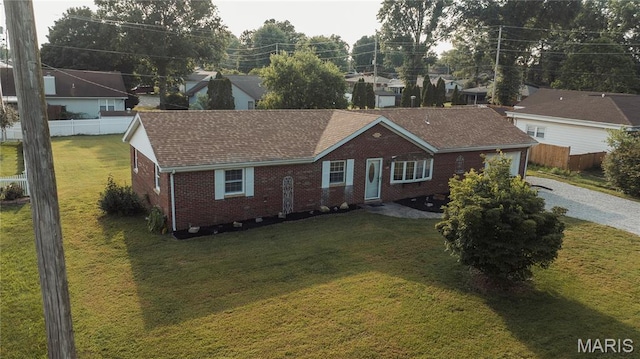 119 Freedom Dr, Belleville, IL 62226 - ranch-style home with brick siding, gravel driveway, roof with shingles, and an attached garage