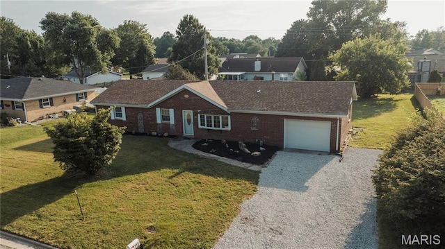 119 Freedom Dr, Belleville, IL 62226 - single story home featuring an attached garage, driveway, brick siding, and a front lawn