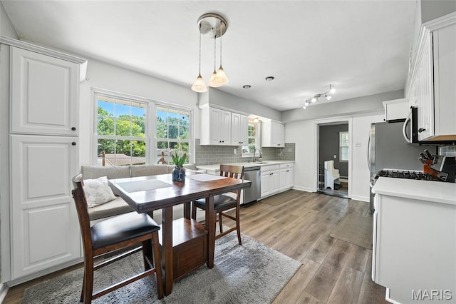 7616 Suffolk Ave, Saint Louis, MO 63119 - dining space featuring healthy amount of natural light and wood finished floors