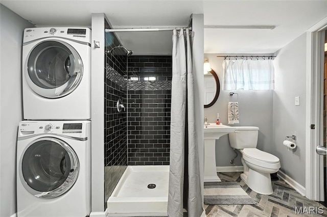 7616 Suffolk Ave, Saint Louis, MO 63119 - bathroom with stacked washing machine and dryer and a shower stall