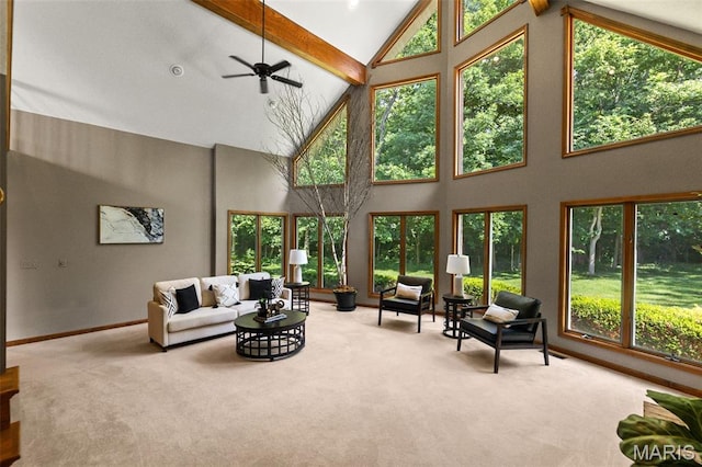 4775 S Hazel Rd, Edwardsville, IL 62025 - carpeted living room with high vaulted ceiling, beamed ceiling, healthy amount of natural light, and a ceiling fan