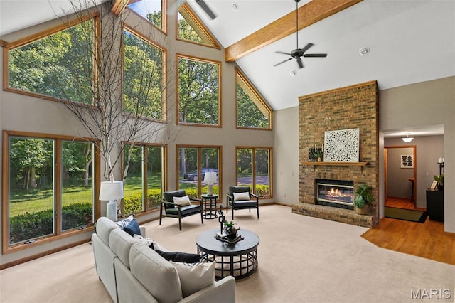 4775 S Hazel Rd, Edwardsville, IL 62025 - living room featuring high vaulted ceiling, a ceiling fan, carpet floors, beam ceiling, and a brick fireplace