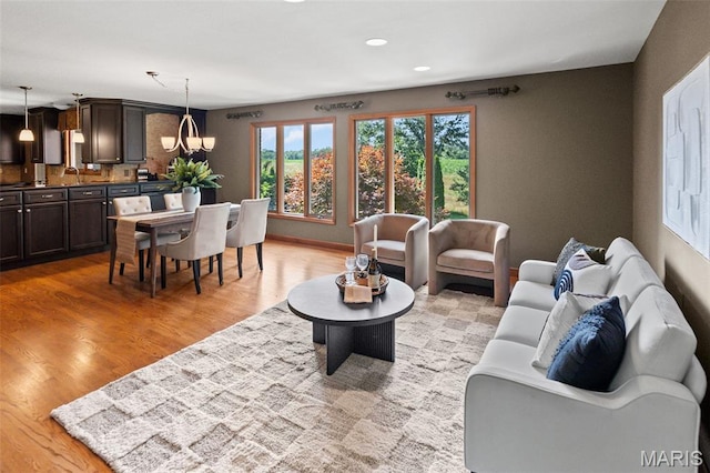 4775 S Hazel Rd, Edwardsville, IL 62025 - living room featuring a chandelier, light wood finished floors, and recessed lighting