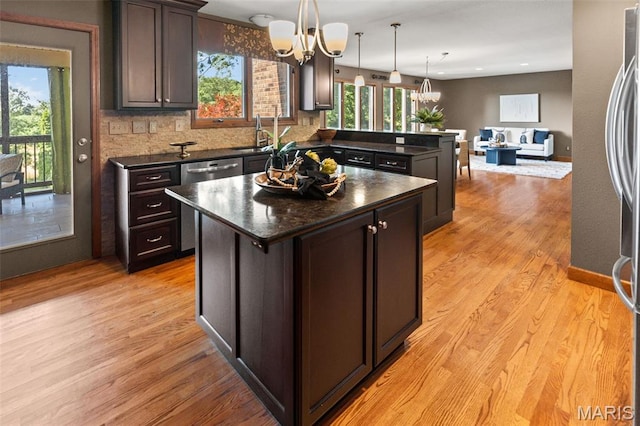 4775 S Hazel Rd, Edwardsville, IL 62025 - kitchen featuring dark countertops, a chandelier, healthy amount of natural light, a center island, and recessed lighting
