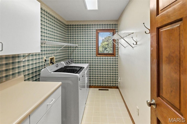 4775 S Hazel Rd, Edwardsville, IL 62025 - laundry area with washing machine and clothes dryer, wallpapered walls, and cabinet space