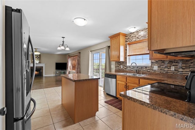 672 Berrywine Ln, Arnold, MO 63010 - kitchen featuring stainless steel appliances, dark countertops, backsplash, and open floor plan
