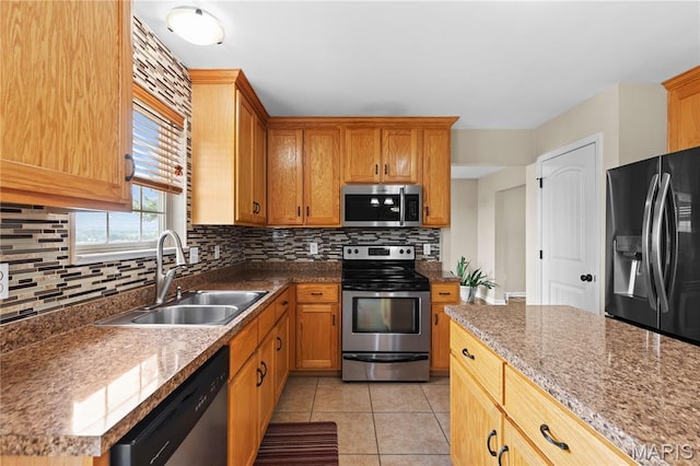 672 Berrywine Ln, Arnold, MO 63010 - kitchen featuring stainless steel appliances, decorative backsplash, and light tile patterned flooring