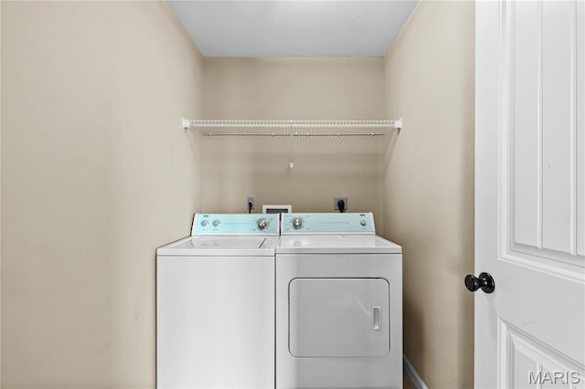 672 Berrywine Ln, Arnold, MO 63010 - laundry area featuring separate washer and dryer