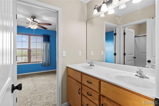 672 Berrywine Ln, Arnold, MO 63010 - bathroom featuring ceiling fan and double vanity