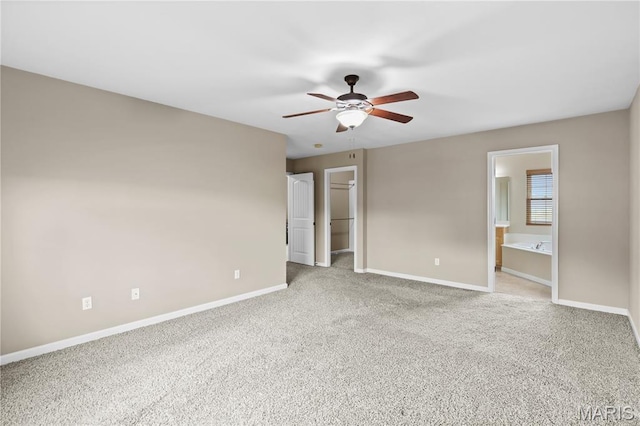 672 Berrywine Ln, Arnold, MO 63010 - unfurnished bedroom featuring carpet, a spacious closet, connected bathroom, and a closet