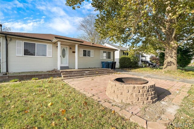8219 Pear Ln, Saint Louis, MO 63123 - view of front of home with an outdoor fire pit