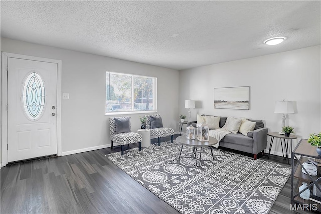 8219 Pear Ln, Saint Louis, MO 63123 - living area featuring dark wood-style floors and a textured ceiling