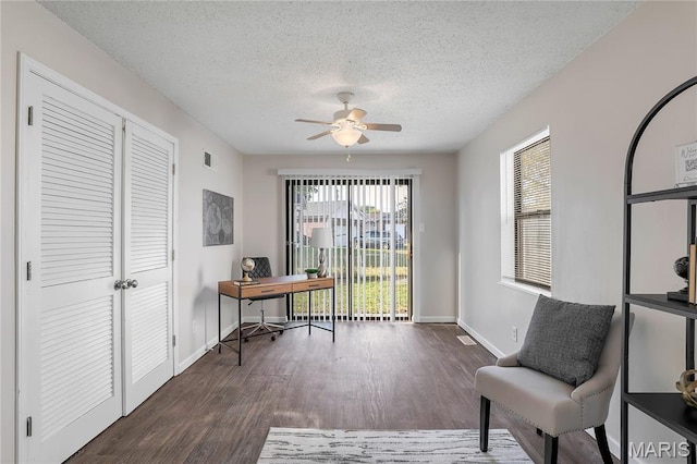 8219 Pear Ln, Saint Louis, MO 63123 - home office with ceiling fan, wood finished floors, and a textured ceiling