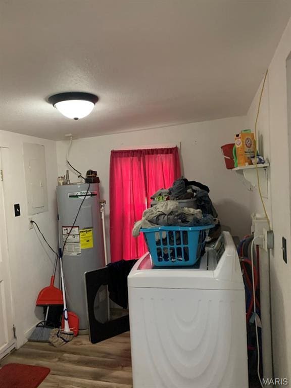 823 W Washington St, St James, MO 65559 - laundry room with washer / dryer, electric water heater, wood finished floors, and electric panel