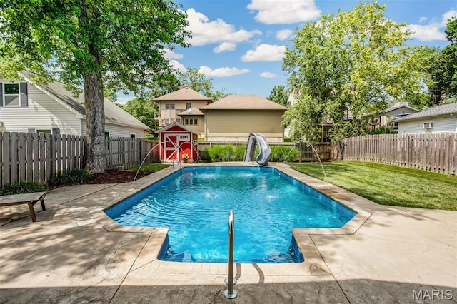 1029 Brownell Ave, Glendale, MO 63122 - view of pool featuring a water slide, a storage shed, a fenced backyard, and a patio area