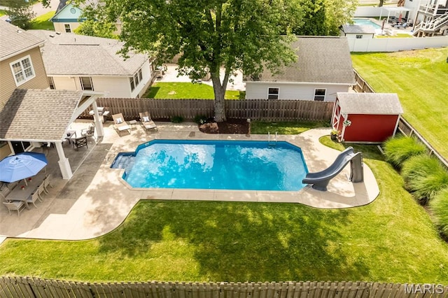 1029 Brownell Ave, Glendale, MO 63122 - view of pool featuring a water slide, a fenced backyard, a patio, and a storage shed