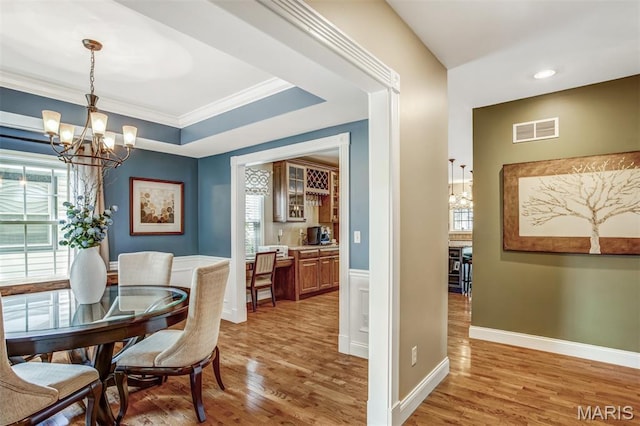 1029 Brownell Ave, Glendale, MO 63122 - dining area featuring a chandelier, light wood-style floors, ornamental molding, a raised ceiling, and recessed lighting