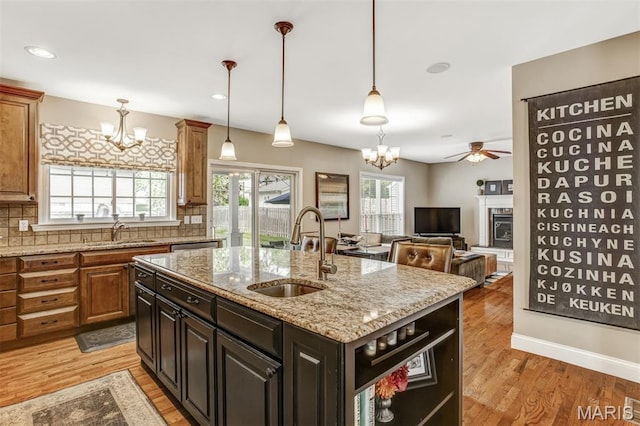 1029 Brownell Ave, Glendale, MO 63122 - kitchen with a chandelier, light wood finished floors, and decorative backsplash