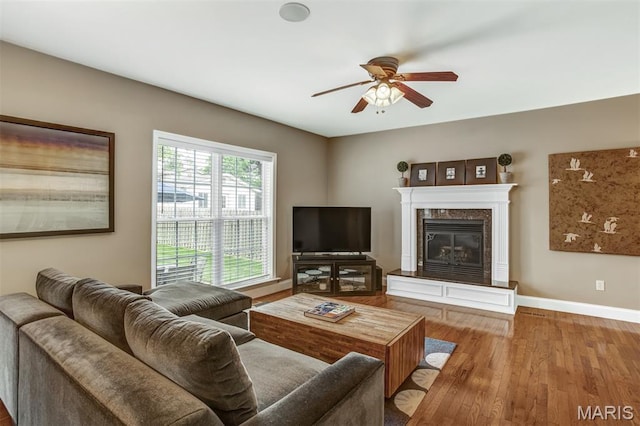 1029 Brownell Ave, Glendale, MO 63122 - living area featuring ceiling fan, wood finished floors, and a fireplace