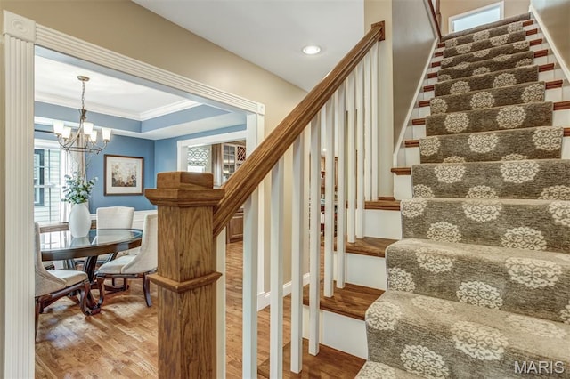 1029 Brownell Ave, Glendale, MO 63122 - staircase featuring wood finished floors, a chandelier, and crown molding