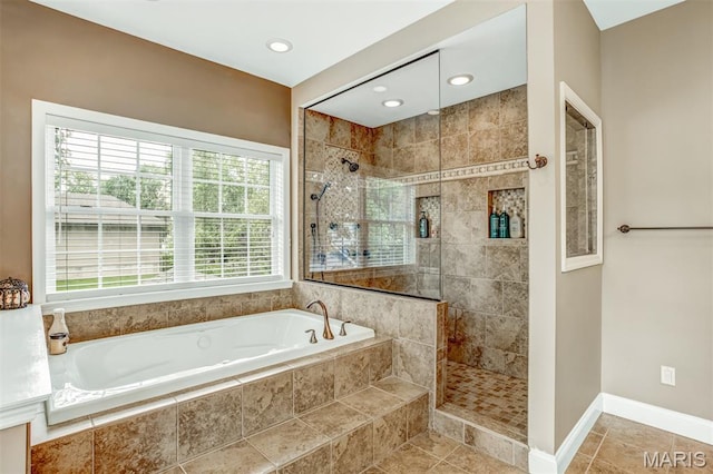 1029 Brownell Ave, Glendale, MO 63122 - full bathroom featuring a garden tub, tiled shower, recessed lighting, and tile patterned flooring