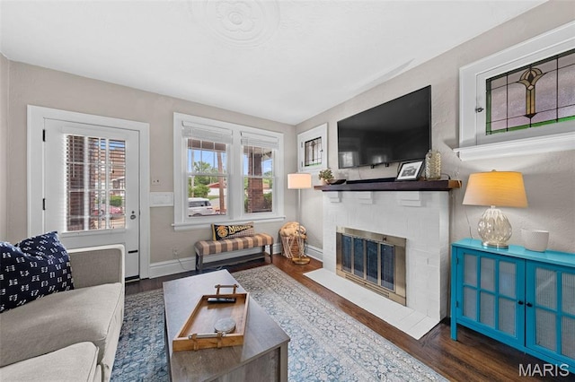6016 Scanlan Ave, Saint Louis, MO 63139 - living area featuring wood finished floors and a brick fireplace