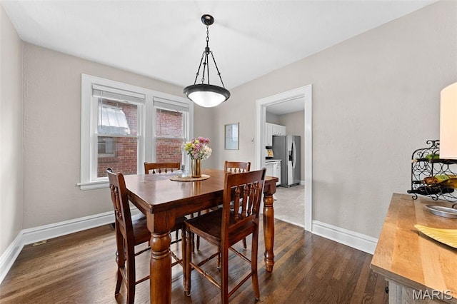 6016 Scanlan Ave, Saint Louis, MO 63139 - dining room with baseboards and dark wood-type flooring