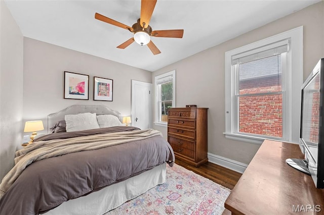 6016 Scanlan Ave, Saint Louis, MO 63139 - bedroom featuring dark wood-style floors and a ceiling fan