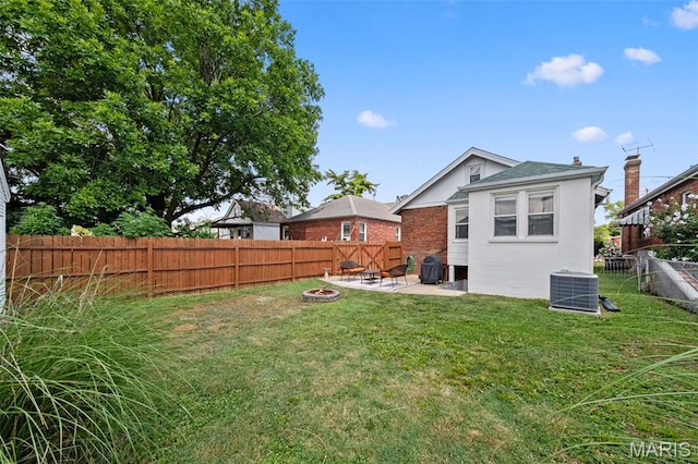 6016 Scanlan Ave, Saint Louis, MO 63139 - rear view of house with a fire pit, a fenced backyard, a patio, and a chimney