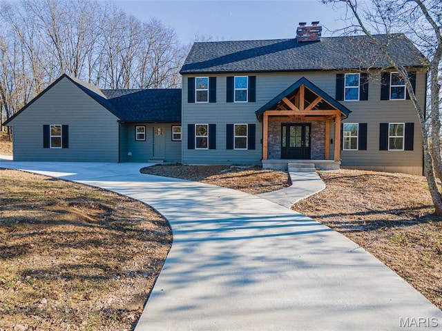 11880 County Road 3040, Rolla, MO 65401 - view of front facade featuring a chimney, a shingled roof, and concrete driveway
