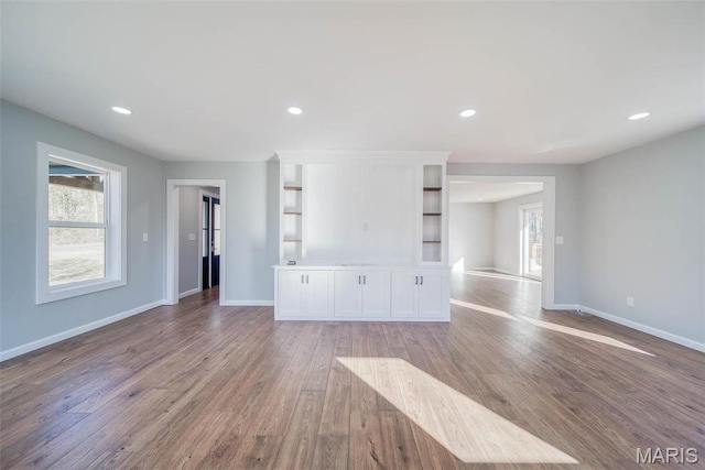 11880 County Road 3040, Rolla, MO 65401 - unfurnished living room featuring healthy amount of natural light, wood finished floors, and recessed lighting