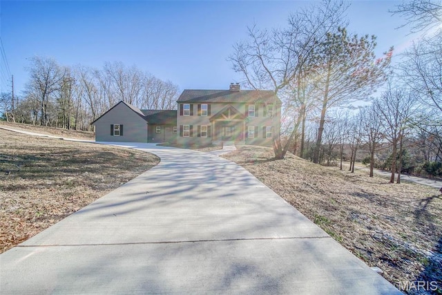 11880 County Road 3040, Rolla, MO 65401 - colonial inspired home featuring driveway and a chimney