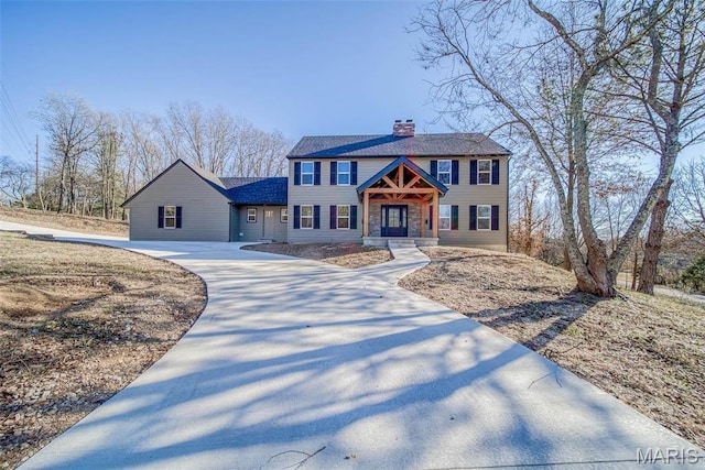 11880 County Road 3040, Rolla, MO 65401 - colonial inspired home featuring a chimney and concrete driveway