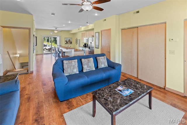 315 Timber Ridge Dr, Grafton, IL 62037 - living area featuring ceiling fan, wood finished floors, and recessed lighting