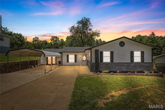 211 Congress St, Park Hills, MO 63601 - ranch-style home featuring driveway, a carport, a front lawn, and brick siding