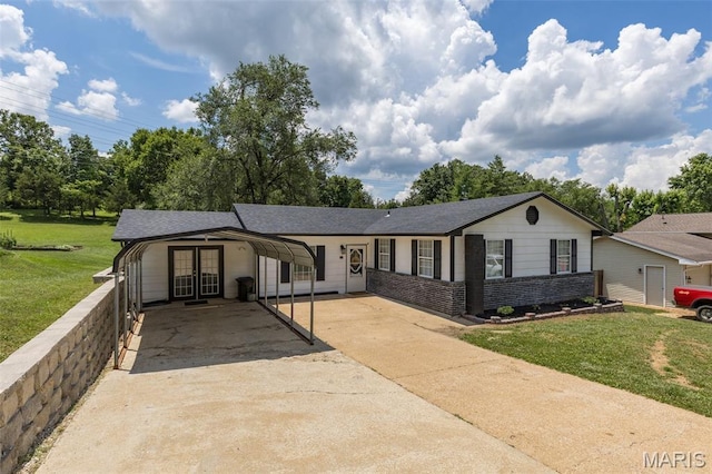 211 Congress St, Park Hills, MO 63601 - ranch-style home featuring french doors, concrete driveway, a front lawn, and a shingled roof