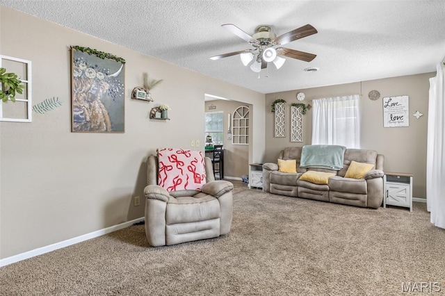 211 Congress St, Park Hills, MO 63601 - living area featuring ceiling fan, a textured ceiling, and carpet flooring