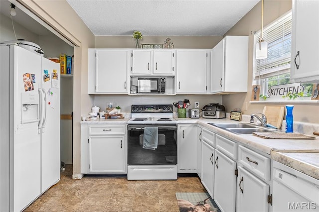 211 Congress St, Park Hills, MO 63601 - kitchen featuring white appliances, white cabinetry, light countertops, a textured ceiling, and decorative light fixtures