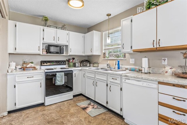 211 Congress St, Park Hills, MO 63601 - kitchen with range with electric cooktop, dishwasher, black microwave, white cabinetry, and light countertops