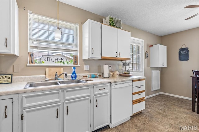 211 Congress St, Park Hills, MO 63601 - kitchen with dishwasher, a ceiling fan, white cabinetry, light countertops, and a textured ceiling