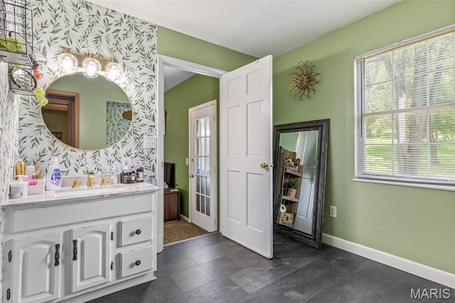 211 Congress St, Park Hills, MO 63601 - bathroom featuring wallpapered walls, vanity, and healthy amount of natural light