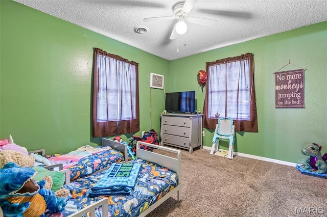 211 Congress St, Park Hills, MO 63601 - carpeted bedroom with a textured ceiling and ceiling fan