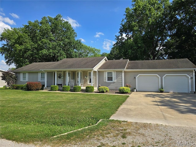 310 E 1st St, Ramsey, IL 62080 - ranch-style home featuring a porch, a garage, driveway, and a front lawn