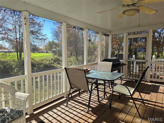 310 E 1st St, Ramsey, IL 62080 - sunroom / solarium with a ceiling fan, outdoor dining area, and healthy amount of natural light