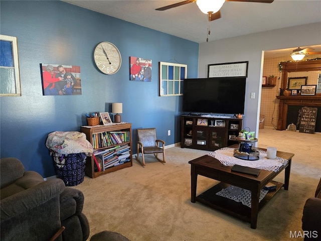 310 E 1st St, Ramsey, IL 62080 - carpeted living area with ceiling fan and baseboards