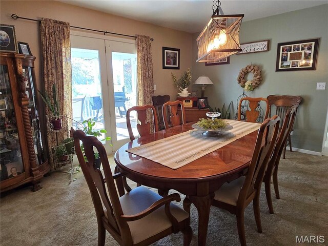 310 E 1st St, Ramsey, IL 62080 - carpeted dining area featuring a chandelier