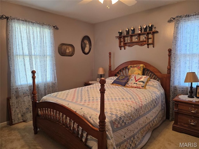 310 E 1st St, Ramsey, IL 62080 - bedroom featuring multiple windows, light carpet, and a ceiling fan