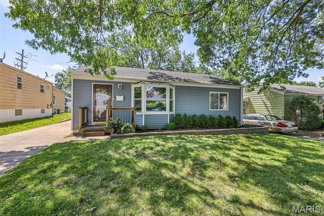 7104 Leona St, Saint Louis, MO 63116 - view of front of house featuring a front yard and driveway